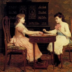 Two girls playing cards
